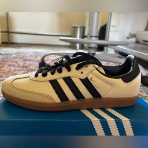 Adidas Black and White Sneakers with Iconic Stripes